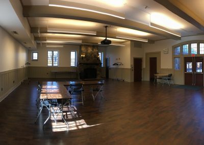 Rowayton Renovation, another view of the community room with stone fireplace